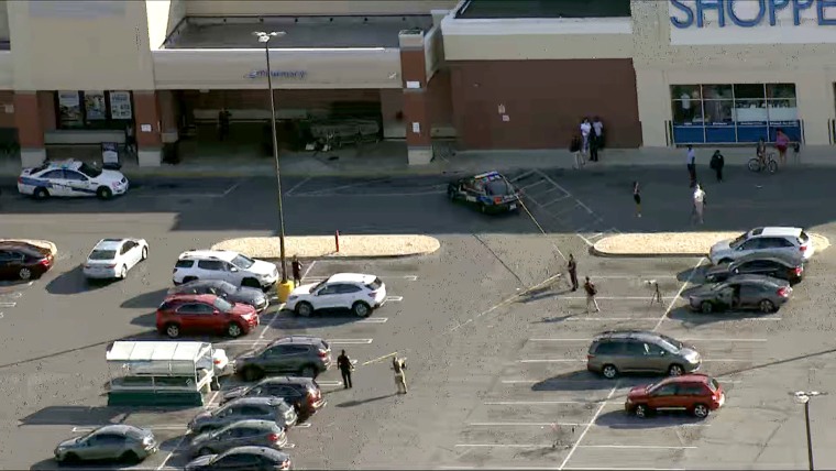 A man is dead, and a woman is injured after a security guard shot them after a physical altercation inside a Giant Food store in northwest Baltimore, police said.