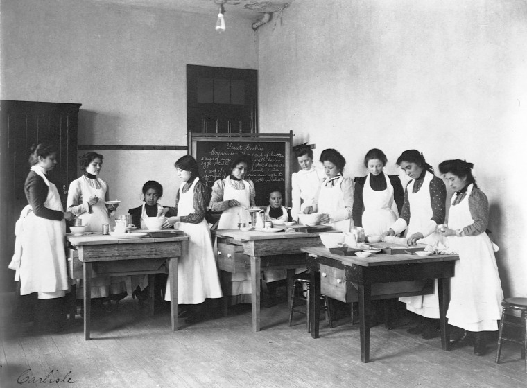 Image: Women study home economics at the Carlisle Indian Industrial Schooll in 1903.