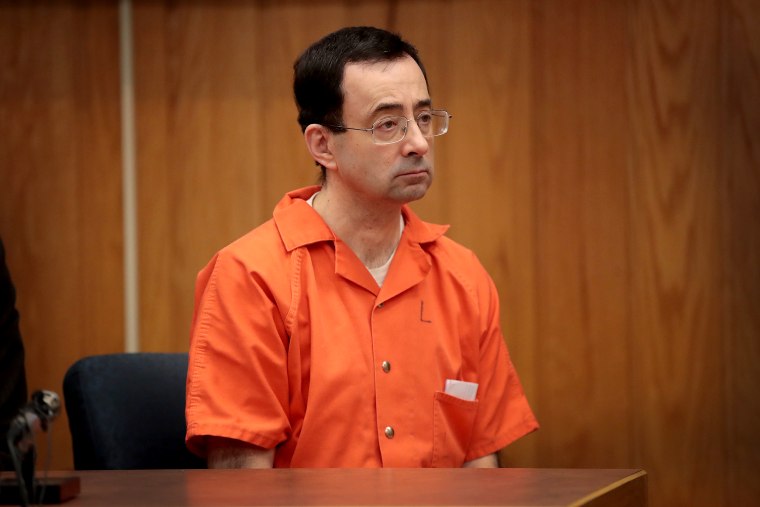 Larry Nassar sits in court listening to statements before being sentenced by Judge Janice Cunningham for three counts of criminal sexual assault in Eaton County Circuit Court on Feb. 5, 2018 in Charlotte, Mich.