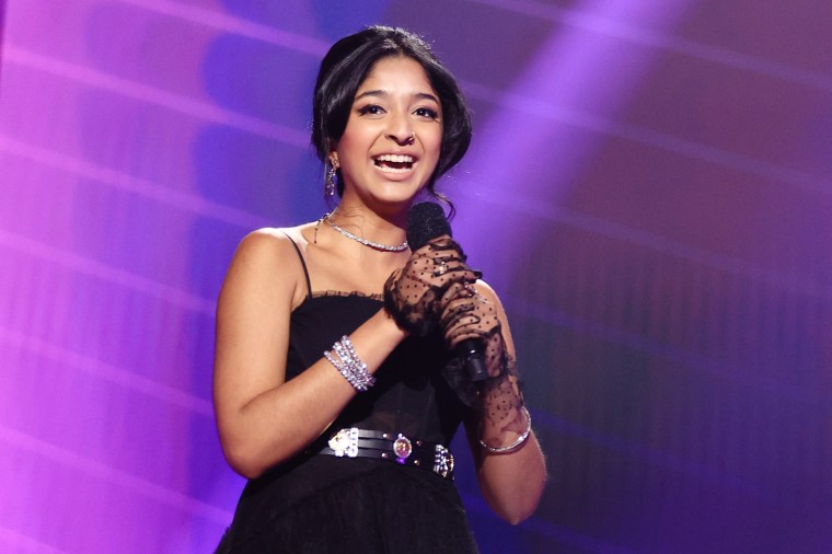 Image: Maitreyi Ramakrishnan accepts the award for \"Comedy Show of 2020\" during the E! People's Choice Awards in Santa Monica, Calif., in November 2020.