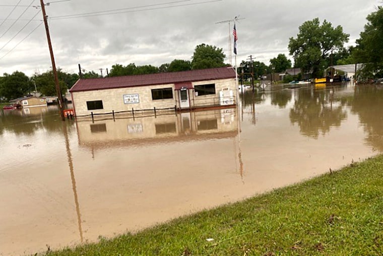 More than a dozen inches of rain fall culminating in flash flooding and emergency evacuation by boat in Amazonia, Mo., on June 24, 2021.