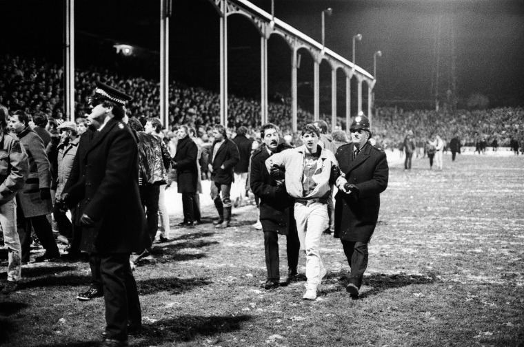 Image: A supporter is arrested at an FA Cup match between Darlington and Middlesbrough in January 1985