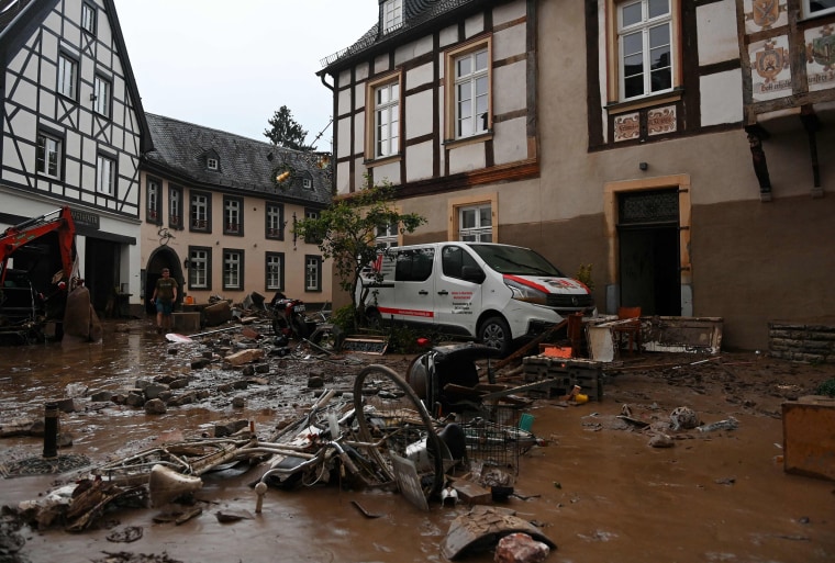 Image: A damaged car and bicycles are pictured in a muddy street in Ahrweiler-Bad Neuenahr, western Germany,