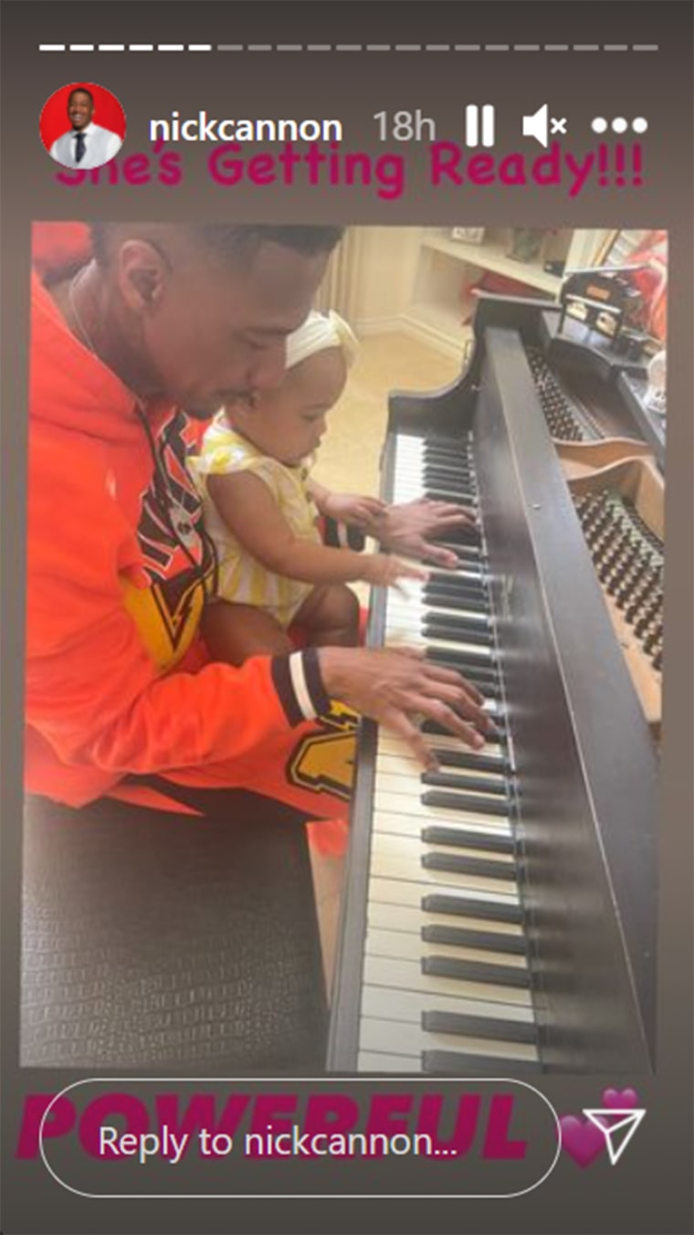 Cannon shows one of his kids the "keys" to playing the piano.