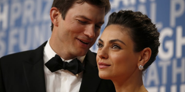 Actor Mila Kunis poses for a picture with her husband actress Ashton Kutcher on the red carpet for the 6th annual 2018 Breakthrough Prizes at Moffett Federal Airfield, Hangar One in Mountain View, Calif., on Sunday, Dec. 3, 2017. (Nhat V. Meyer/Bay Area N