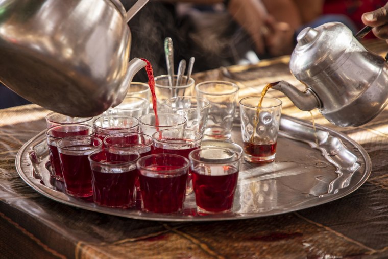 Serving hibiscus tea