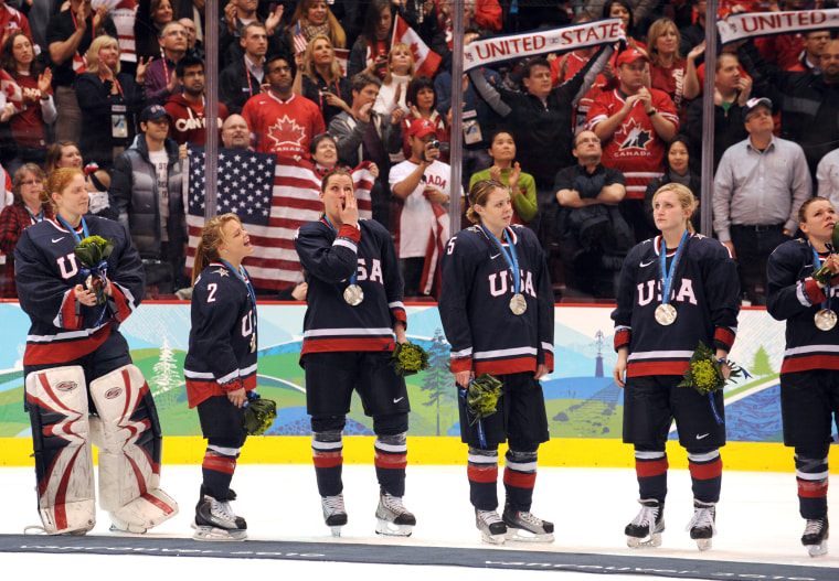 Dejected members of the USA team wear t