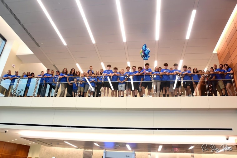Community members showed up wearing matching blue T-shirts to support Nate on his adoption day at the Bucks County courthouse in Pennsylvania.