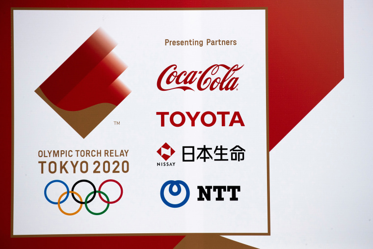 Image: A banner advertising Coca-Cola beverages, Toyota, Nissay and NTT, Olympic Games partner for Tokyo 2020, in Fukushima prefecture