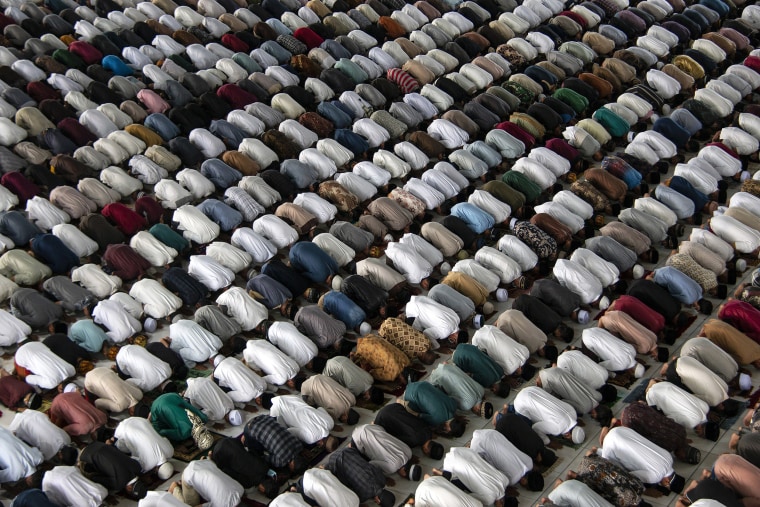 Image: Muslims pray inside a mosque during an Eid al-Adha prayer in Lhokseumawe, Aceh province, Indonesia