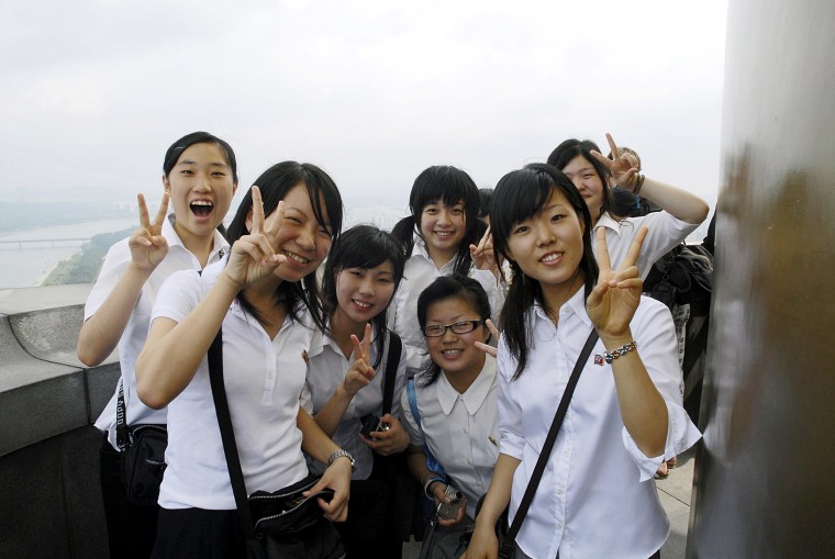 Image: North Korean high school students visit the Juche Tower, built to commemorate the 70th birthday of former President Kim Il Sung.
