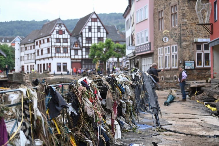 Image: People look at the debris in the pedestrian zone in Bad Muenstereifel, western Germany,