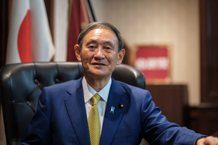 Image: Newly elected leader of Japan's Liberal Democratic Party (LDP) Yoshihide Suga poses for a portrait at his office following his press conference at the party's headquarters in Tokyo o