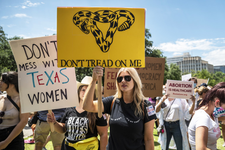 Protesters rally against a bill outlawing abortions after a fetal heartbeat is detected outside the Texas state capitol on May 29, 2021, in Austin.