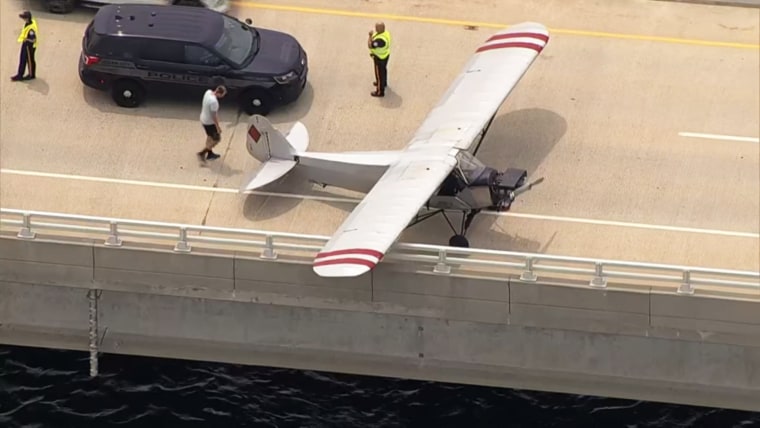 Landon Lucas safely landed his banner-pulling plane on bridge in New Jersey.