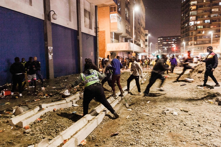 Image: South Africa Police Services officers stop looters from looting in central Durban, South Africa