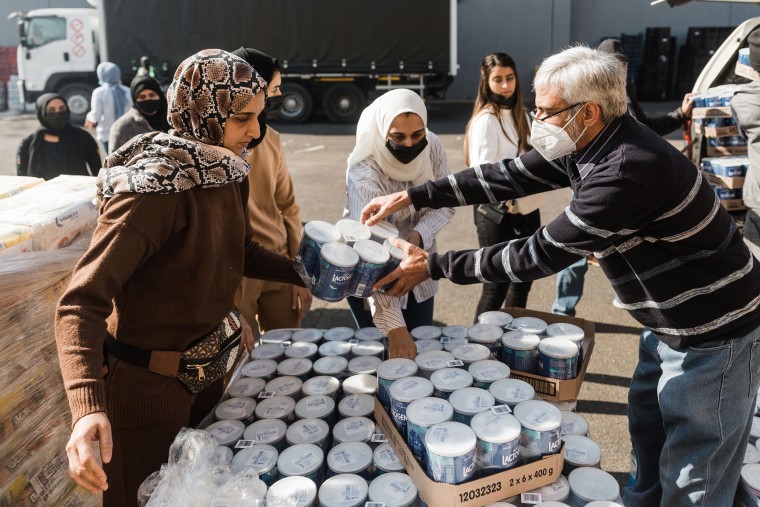 Image: A volunteer from Muslims For Humanity pack baby food at the NMJ Islamic Centre to distribute to members of the public in Durban, South Africa