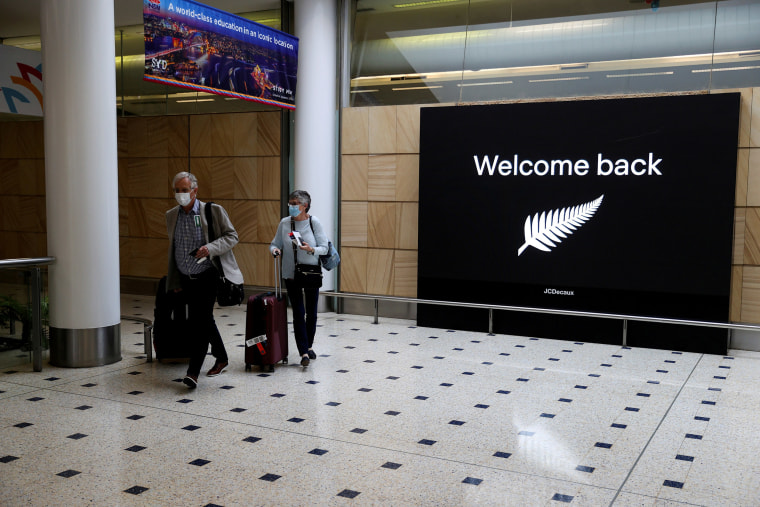 Image: Passengers arrive from New Zealand after the Trans-Tasman travel bubble opened overnight, following an extended border closure, at Sydney Airport in Sydney, Australia,