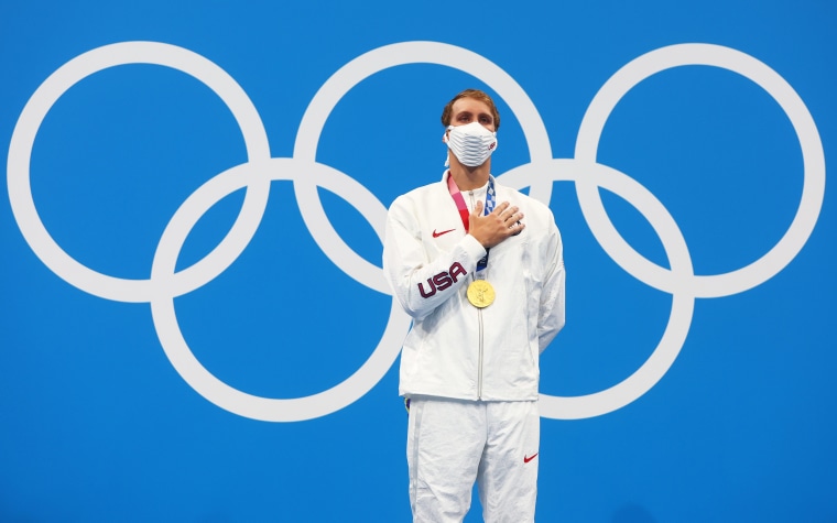 Gold medalist Chase Kalisz of the United States celebrates on the podium at the Olympics in Tokyo on July 25, 2021.