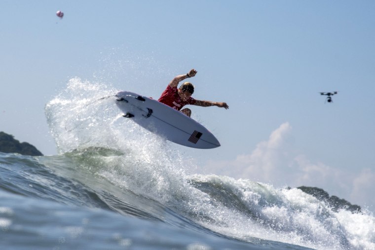 USA's Kolohe Andino rides a wave during the men's Surfing first round at the Tsurigasaki Surfing Beach in Chiba, Japan, on July 25, 2021, at the Olympics.
