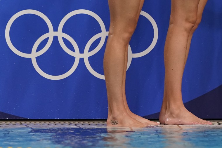 A United States player stands with an Olympic ring tattoo on her foot during a preliminary round women's water polo match against Japan at the 2020 Summer Olympics, Saturday, July 24, 2021, in Tokyo, Japan. 