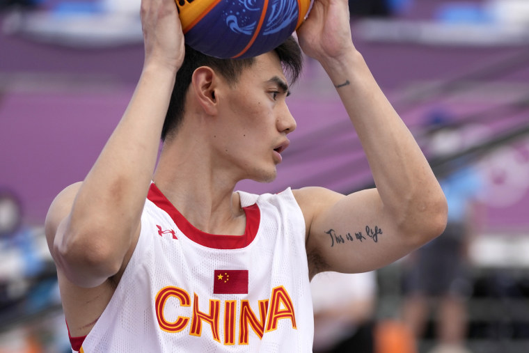 China's Yan Peng has a tattoo on his arm during a men's 3-on-3 basketball game against Latvia at the 2020 Summer Olympics, Sunday, July 25, 2021, in Tokyo, Japan.