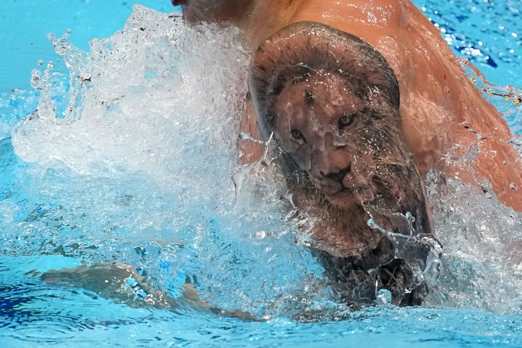 Adam Peaty, of Britain, swims the men's 100-meter breaststroke at the 2020 Summer Olympics, Saturday, July 24, 2021, in Tokyo, Japan.