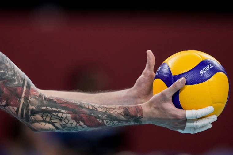 Ivan Iakovlev, of the Russian Olympic Committee, prepares to serve during the men's volleyball preliminary round pool B match between United States and Russian Olympic Committee at the 2020 Summer Olympics in Tokyo, Japan.