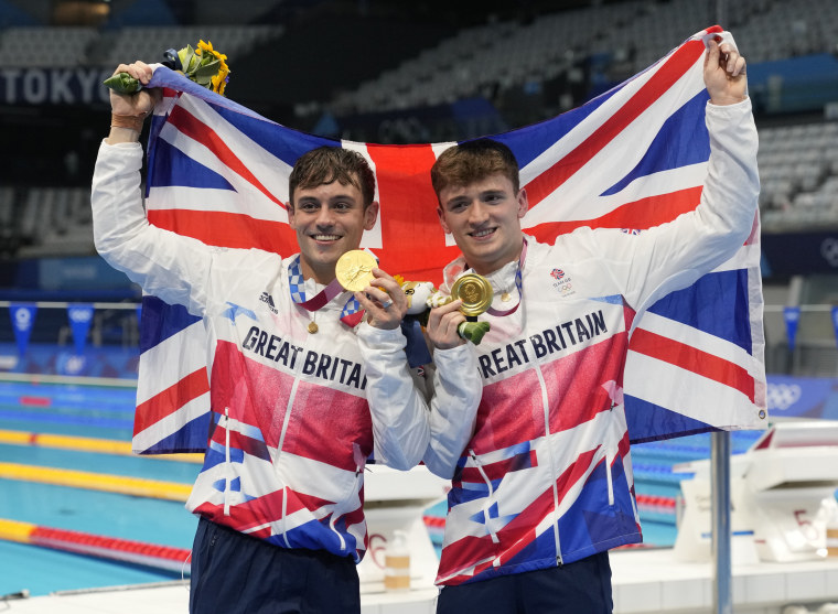 Thomas Daley and Matty Lee of Britain pose for a photo after winning gold medals during the men's synchronized 10m platform diving final at the Tokyo Aquatics Centre at the 2020 Summer Olympics, on July 26, 2021, in Tokyo, Japan.