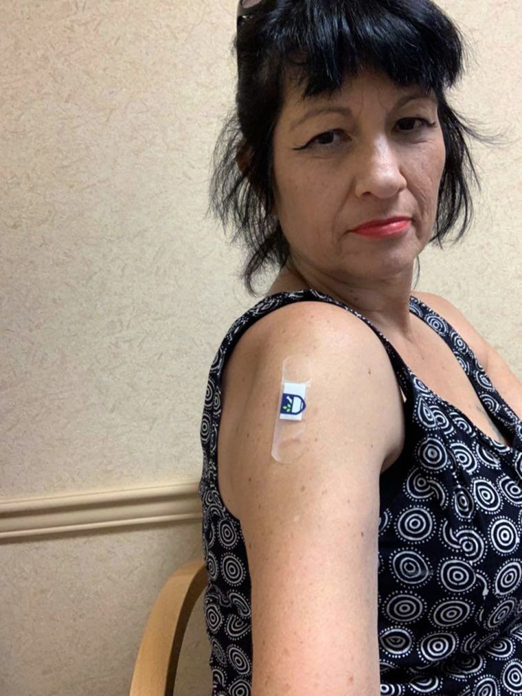 After her husband died of COVID-19, Mia Ponte Vinnard has been on a mission to encourage others to get the vaccine. She received her first dose this week. 