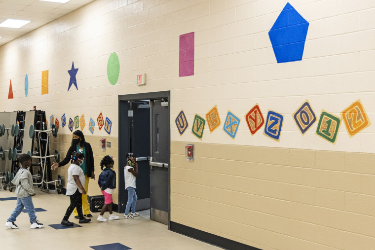 Students are led to their classroom at the start of the day during summer school at Ida Green Elementary in Belzoni, Miss., on June 30, 2021.