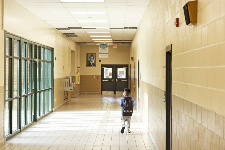 A student makes his down a hallway during summer school at Ida Green Elementary.