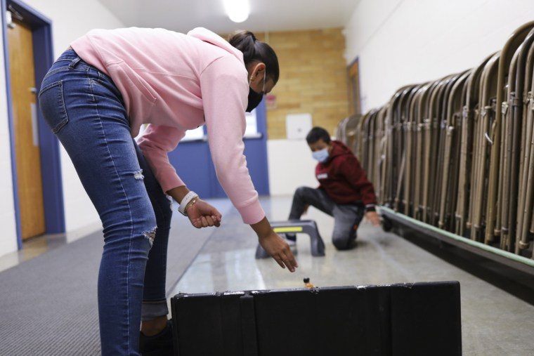 Aylin Garcia Rosa, 9, attempts to get the car she built with her cousin down a ramp and through a "tunnel" during a summer program held in Oregon City.