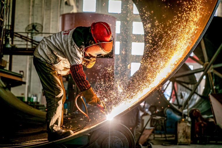 Image: Engineering equipment is prepared for export in March at a factory in China's eastern Jiangsu province