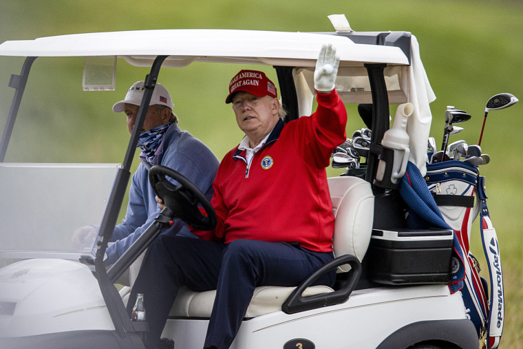 Then-President Donald Trump golfs at Trump National Golf Club on Nov. 27, 2020, in Sterling, Va.