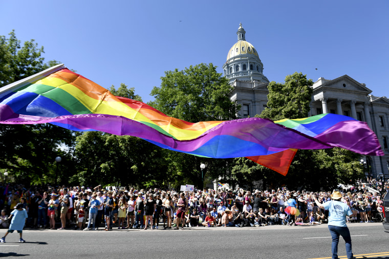 A pride flag flies near the Colorado State Capitol along the Denver Pride Parade route on June 16, 2019 in Denver.