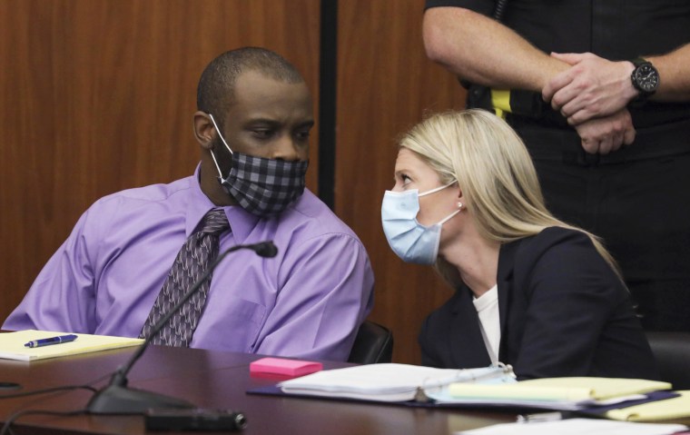 Defendant Nathaniel Rowland speaks with his attorney, Alicia Goode, during his trial in Richland County Court on July 20, 2021, in Columbia, S.C.
