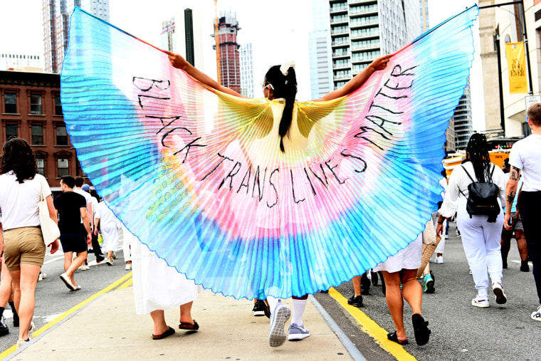 A protestor wearing \"Black Trans Lives Matter\" wings marches during the \"Brooklyn Liberation: An action for Trans Youth March\" on June 13, 2021, in New York.