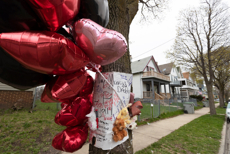 A memorial to five people who were shot to death adorns a tree in Milwaukee on April 28, 2020.