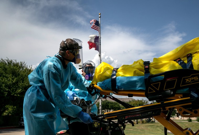 Image: Medics with Austin-Travis County EMS transport a nursing home resident with coronavirus symptoms on Aug. 3 in Austin, Texas.