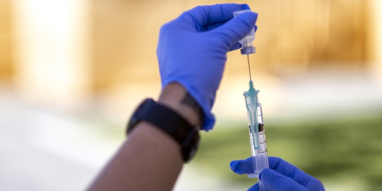 People receive COVID-19 vaccinations at a Medi-Vaxx Program of the San Fernando Valley