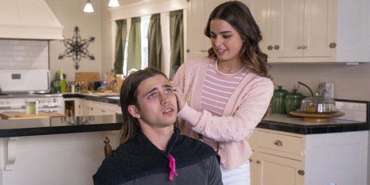 In this gender-swapped reboot, Addison Rae's character creates a prom king out of high school nobody Cameron Kweller, played by "Cobra Kai" actor Tanner Buchanan.