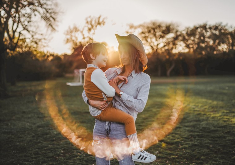 Eileen Lamb of The Autism Cafe holds her autistic son, Charlie.