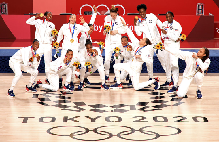 Team United States celebrate with their gold medals  during the Women's Basketball medal ceremony on day sixteen of the 2020 Tokyo Olympic games at Saitama Super Arena on August 08, 2021.