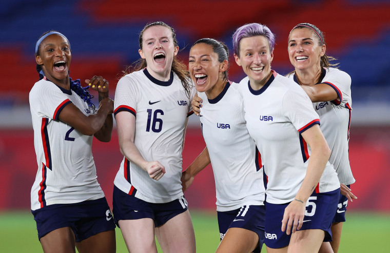 Crystal Dunn, Rose Lavelle, Christen Press, Megan Rapinoe and Alex Morgan of Team United States celebrate following their team's victory in their quarterfinal match against the Netherlands on July 30, 2021, at the Olympics in Yokohama, Japan.