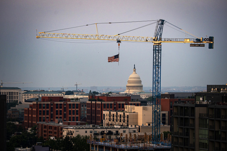 A construction crane in front of the U.S. Capitol on Aug. 2, 2021.