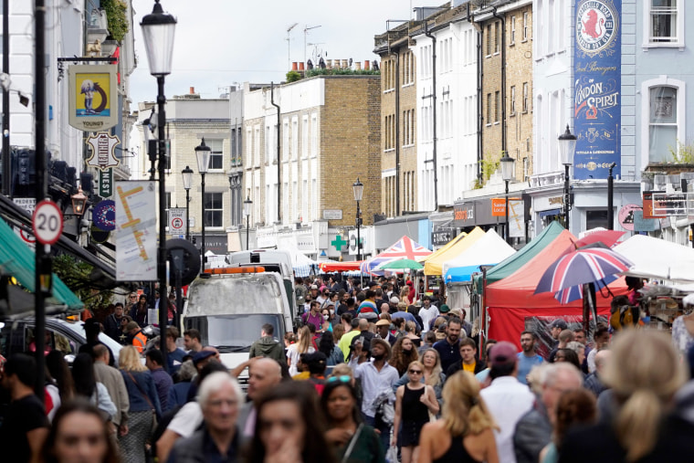 Image: Shoppers on Portobello Road market in London's Notting Hill