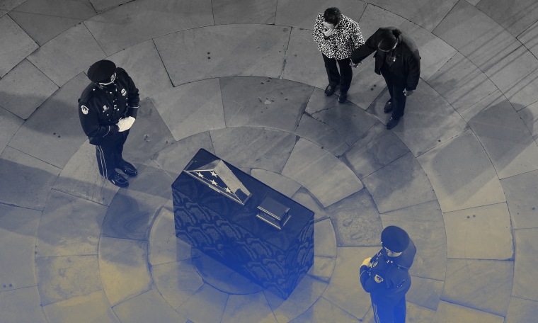 Image: People mourning during a ceremony for Capitol officer Brian D. Sicknick in the Rotunda of the U.S. Capitol.