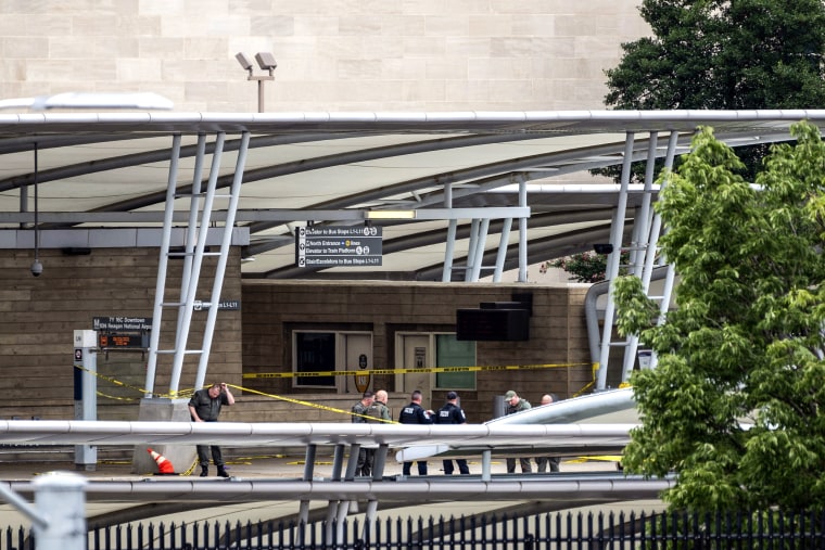 Image: A police officer passes underneath barrier tape outside the Pentagon Metro area on Aug. 3, 2021, at the Pentagon in Washington.