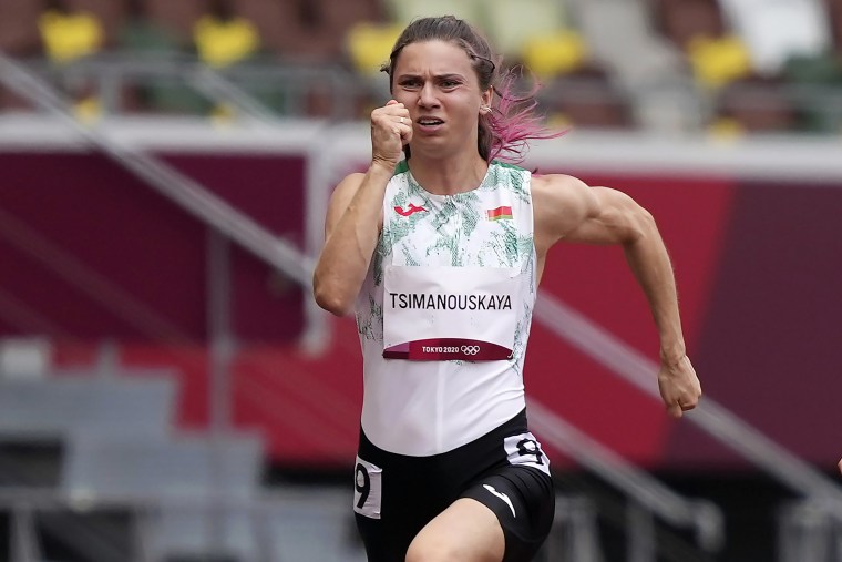Image: Krystsina Tsimanouskaya, of Belarus, runs in the women's 100-meter run at the Tokyo Olympics on July 30, 2021.